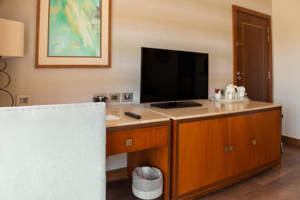 Sharm Dreams Vacation Club - Aqua Park Hotel Ngoại thất bức ảnh A television in a hotel room